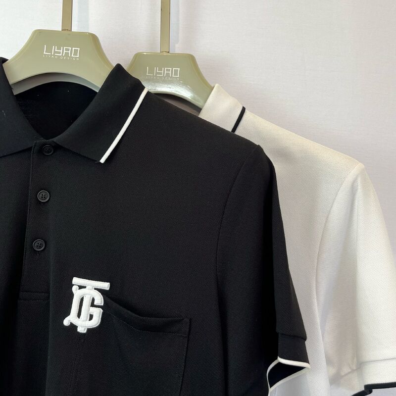 Mensenlogo - geborduurd polo shirt. Zwart met witte trim borstzak en monogram trendy design Pique mannen polo shirt